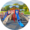 Rounded image of a slide playground structure with blue and tan slides